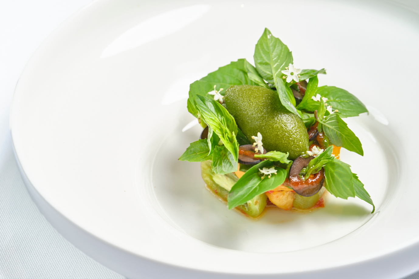 A plate of food on a white surface

Description automatically generated