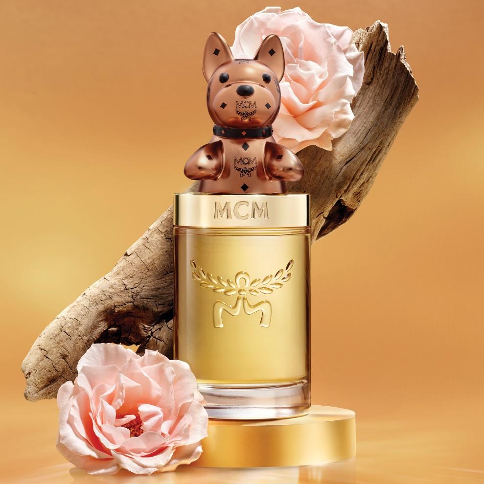 A bottle of perfume with a dog on top
AI-generated content may be incorrect.