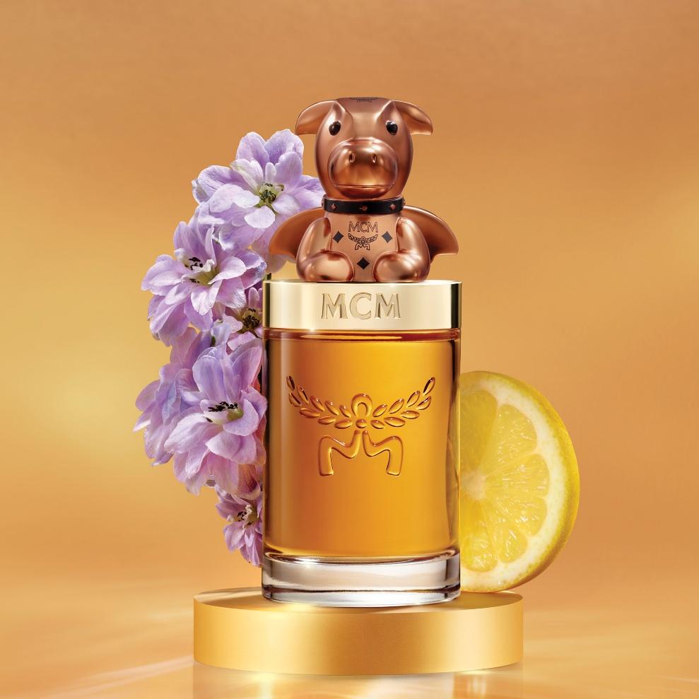 A bottle of perfume with a cow figurine
AI-generated content may be incorrect.