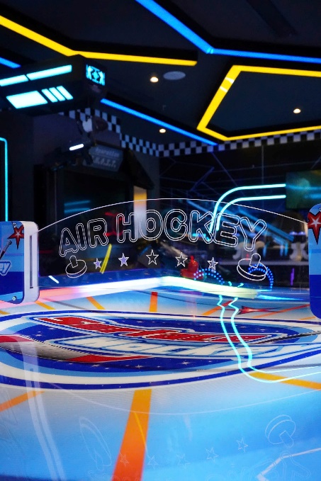 A hockey rink with neon lights
AI-generated content may be incorrect.